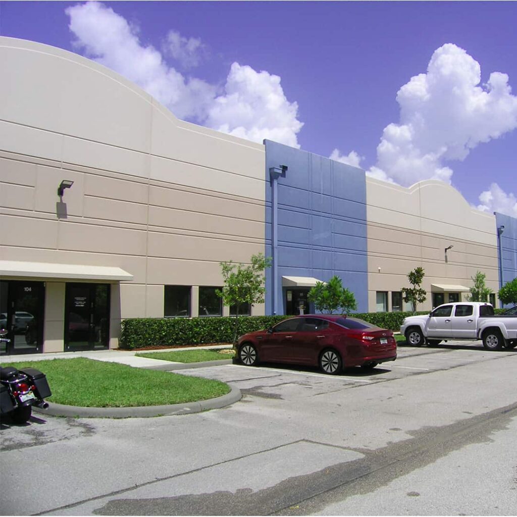 Blue and Tan Industrial Office with large parking lot in South Florida Funded Deal