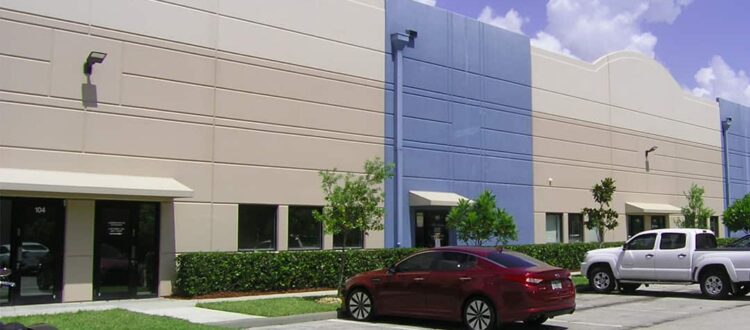 Blue and Tan Industrial Office with large parking lot in South Florida Funded Deal