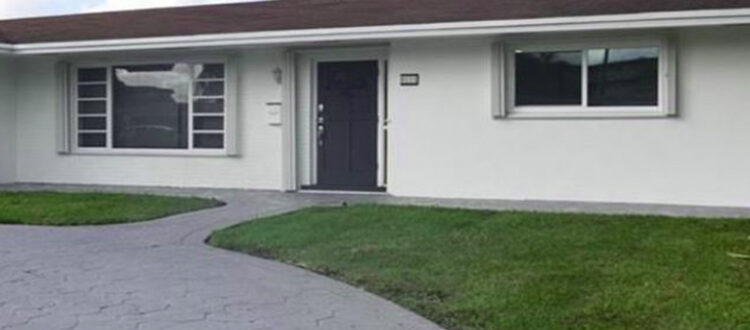 White and Grey Residential Investment Property with Grassy Yard, Large Driveway, and Front-Facing Windows Funded Deal South Florida