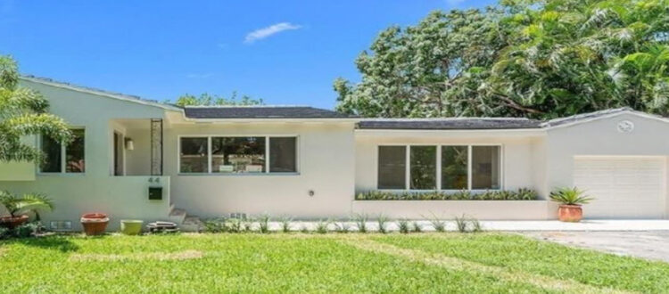 White Residential House Funded Deal with a Large Front Yard and Garage in Florida