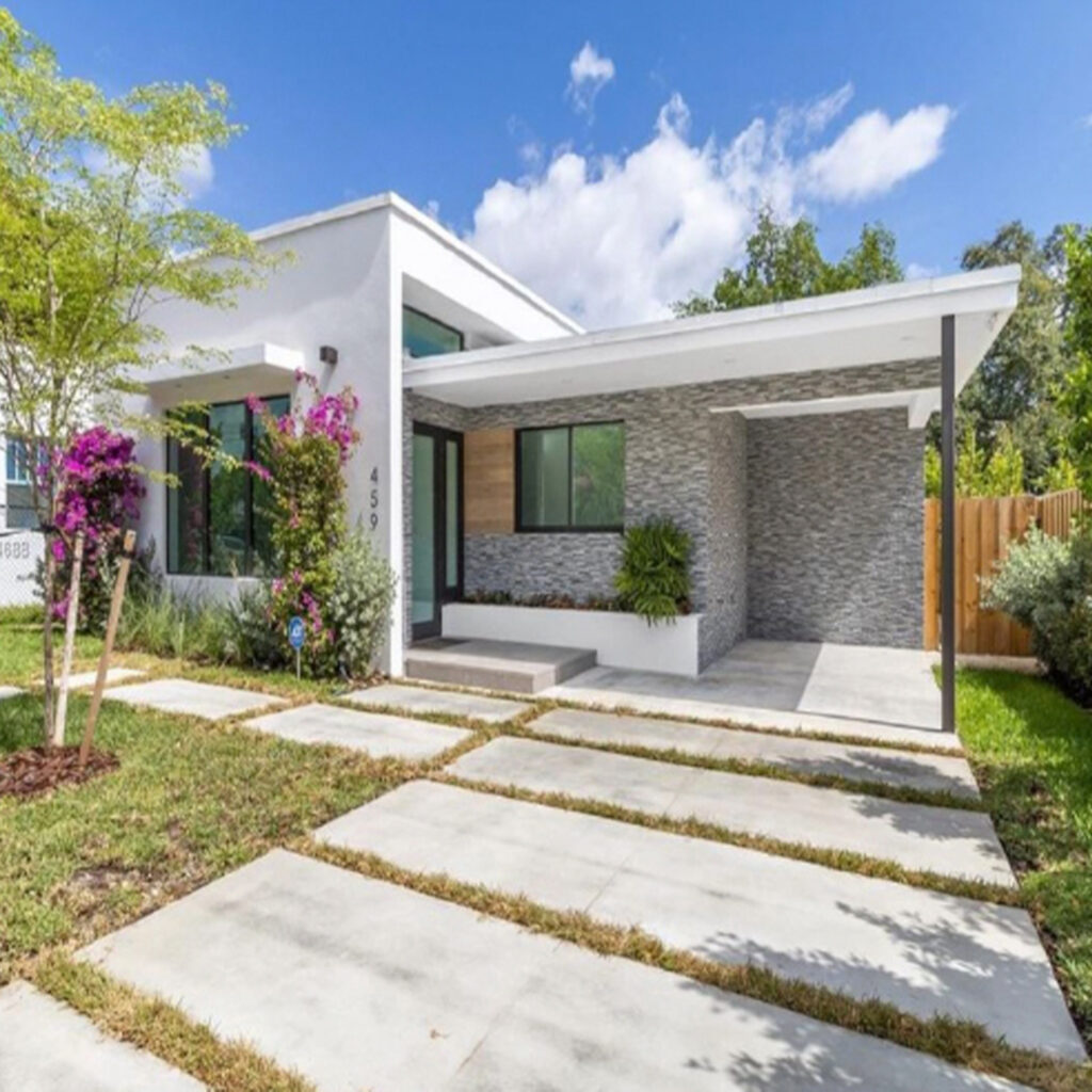 Modern Residential House with Shaded Awnings in South Florida on a Partly-Cloudy Day Funded Deal