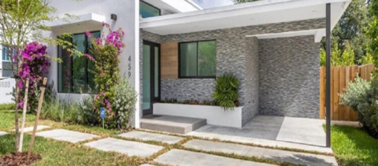 Modern Residential House with Shaded Awnings in South Florida on a Partly-Cloudy Day Funded Deal