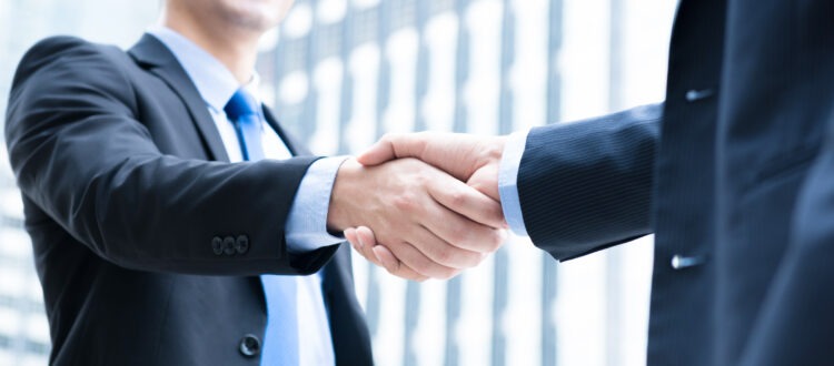 Businessmen Sharing Handshake in Southern Florida