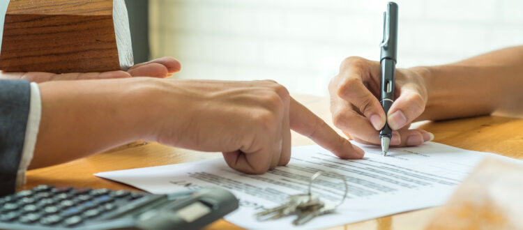 Buyers Signing a Home Purchase Agreement from a Broker South Florida