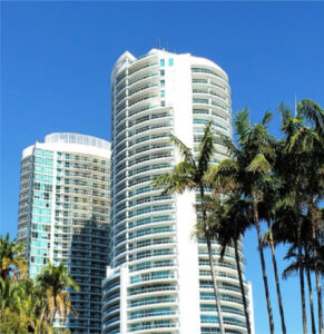 Large Apartment or Office Space with Palm Trees on a Blue Sky Day in South Florida