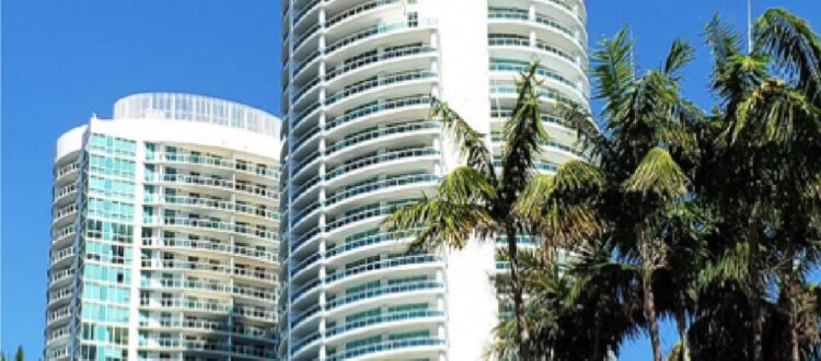 Large Apartment or Office Space with Palm Trees on a Blue Sky Day in South Florida