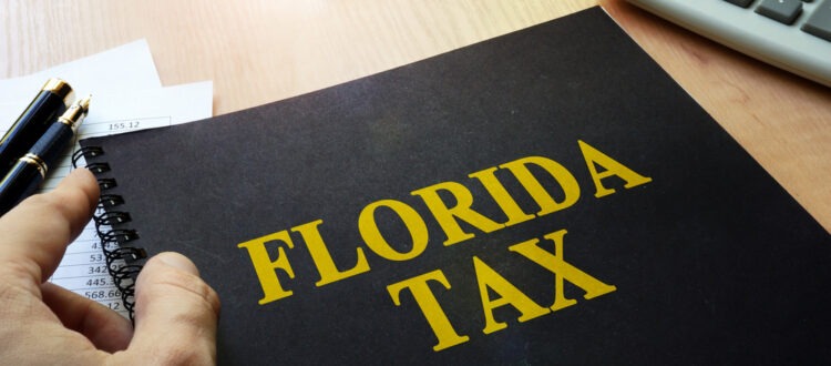 Book with title of Florida Tax on a desk
