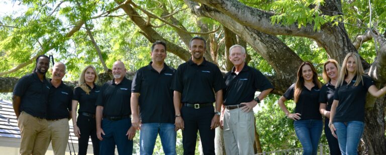 Community Capital Holdings team outside under a tree