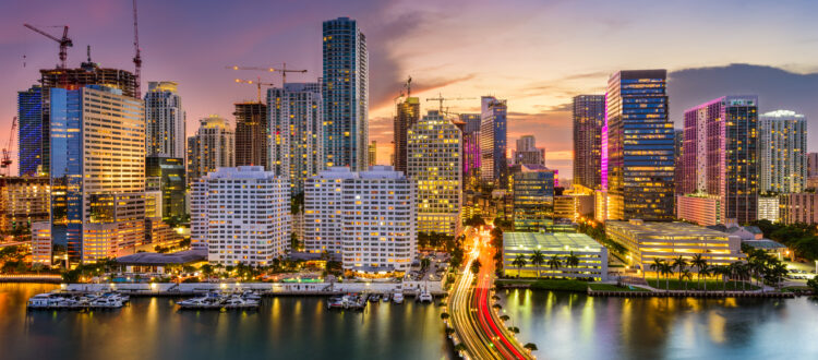 Gorgeous skyline of Miami, Florida at sunset with the ocean hard money real estate