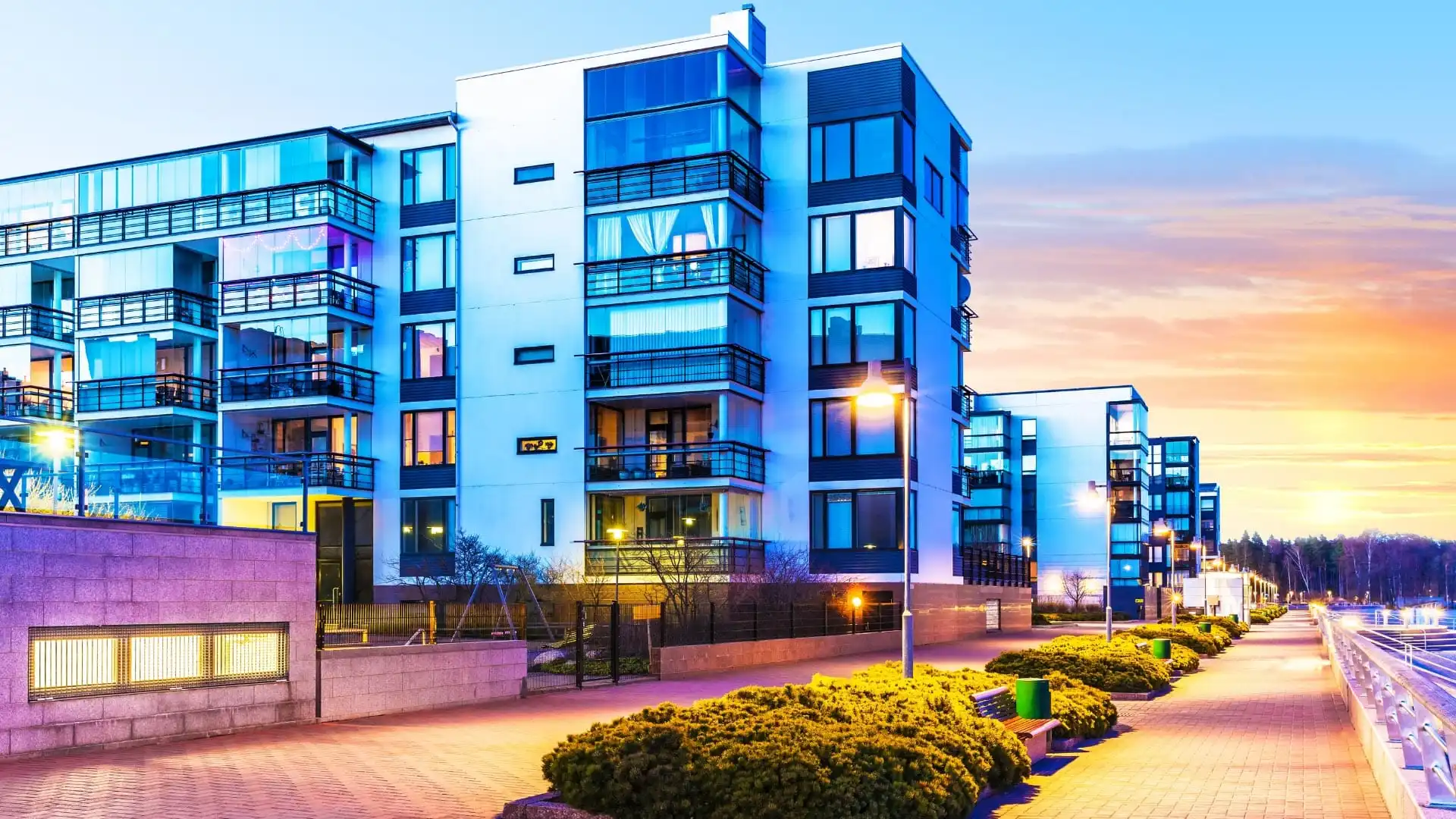 Modern Apartment building in Florida at sunset next to a pathway